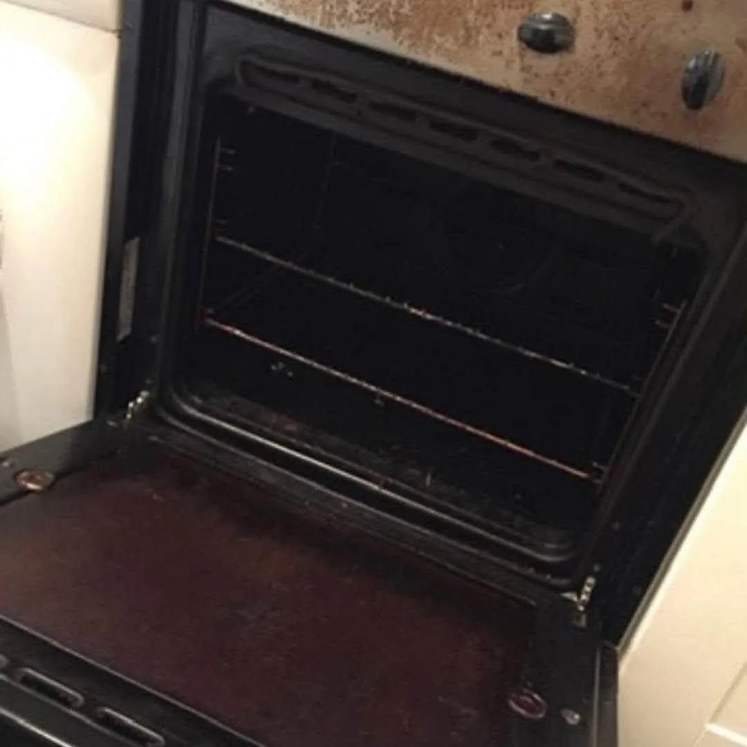 Oven interior before cleaning with burnt-on grease