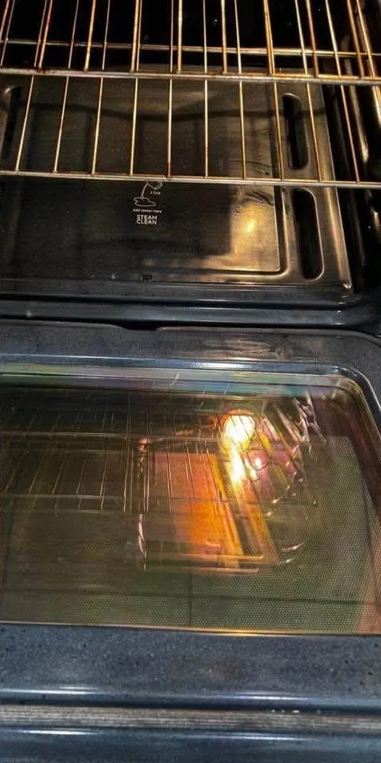 Oven door glass after cleaning, clear and streak-free