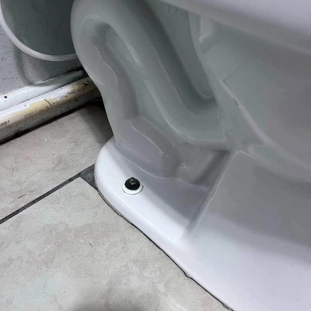 Toilet base after cleaning, white and spotless